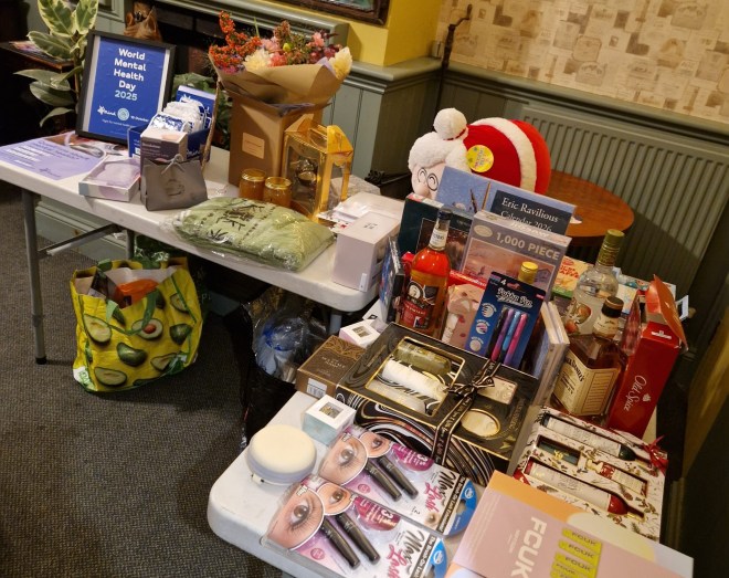 Mind Cambridge raffle prizes laid out at The Grapes including many donated by the pub