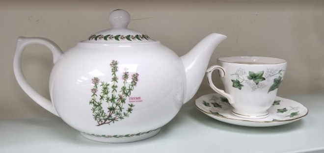 Thyme To Talk preloved teapot (with the word Thyme and a picture of the herb on the front, playing with Time) and cup from Mind Cambridge