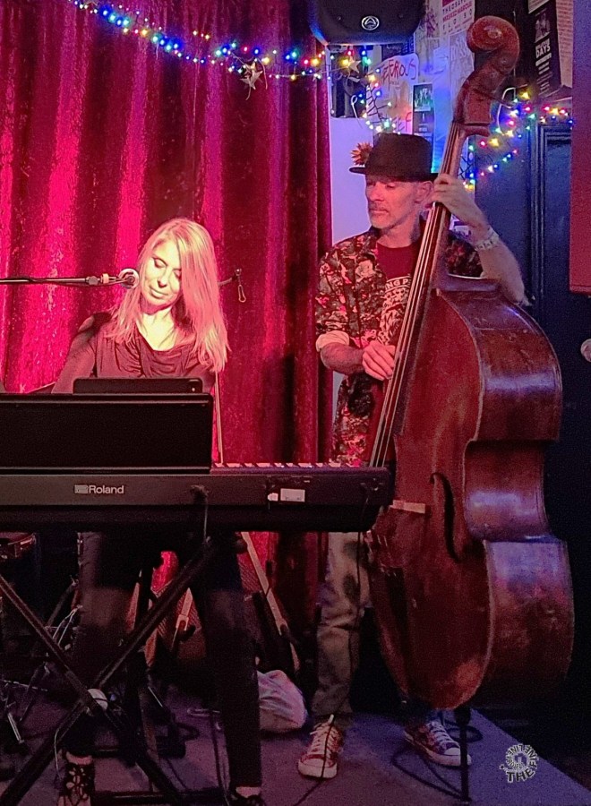 Angie Collins and Fabian Bonner, photographed by The Fine Line Project at a Cambridge Radio benefit at The Blue Moon, September 2026